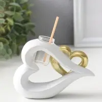 Аромадиффузор полистоун с палочками "Сплетённые сердца" белый с золотом 4,7х12,3х9 см