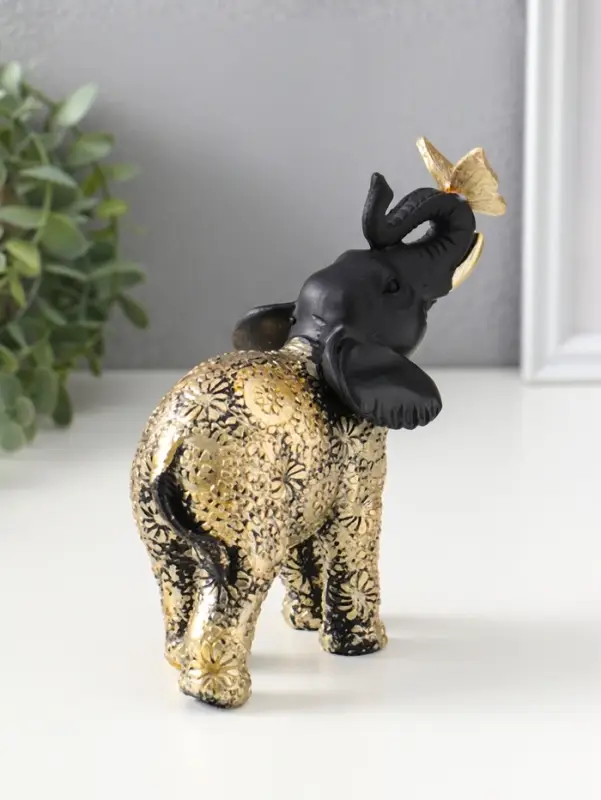 Сувенир полистоун "Чёрный слонёнок с бабочкой на хоботе" с золотом 7,5х12,7х15,7 см