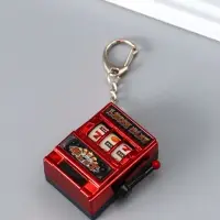 Брелок пластик "Игровой автомат - казино" красный 2,7х3,4х5 см Брелок пластик "Игровой автомат - казино" красный 2,7х3,4х5 см