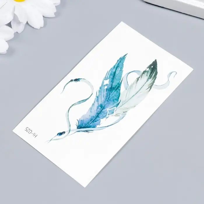 Переводные тату на тело цветные светящиеся «Пёрышки на ленте», 10.5×6 см Переводные тату на тело цветные светящиеся «Пёрышки на ленте», 10.5×6 см