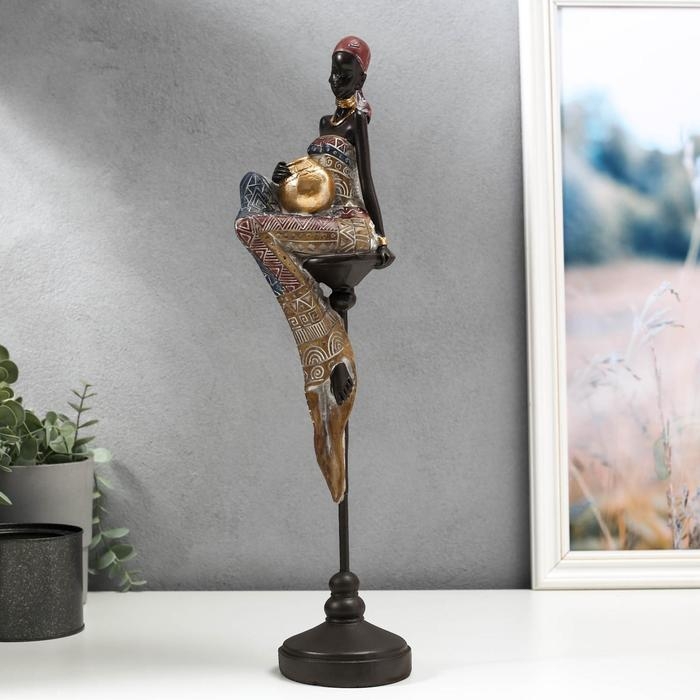 Сувенир полистоун  Сувенир полистоун "Африканка с кувшином, в наряде - геометрия, на стуле" 43х11х9,3 см