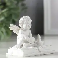 Сувенир полистоун "Ангелок с лупой на книге" белый 7,7х5х7 см Сувенир полистоун "Ангелок с лупой на книге" белый 7,7х5х7 см