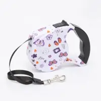 Рулетка с поводком-лентой, резиновая ручка, 5 м, вес животного до 15 кг, узоры на белом