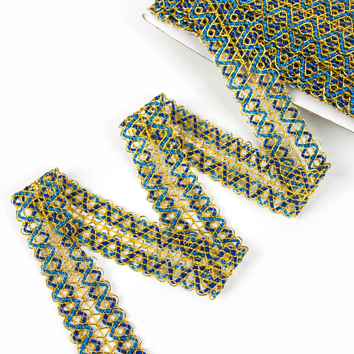 Тесьма «Зигзаг», ширина 3,5 см., в рулоне 25 м., сине-голубо-золотая Тесьма «Зигзаг», ширина 3,5 см., в рулоне 25 м., сине-голубо-золотая