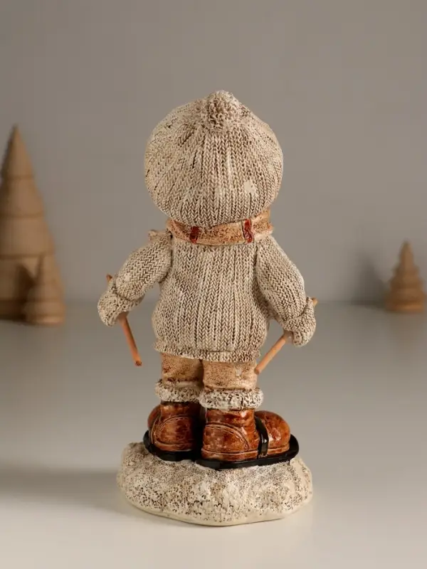 Сувенир полистоун  Сувенир полистоун "Малыш в вязаном наряде на мини-лыжах" 8,5х8х17,5 см