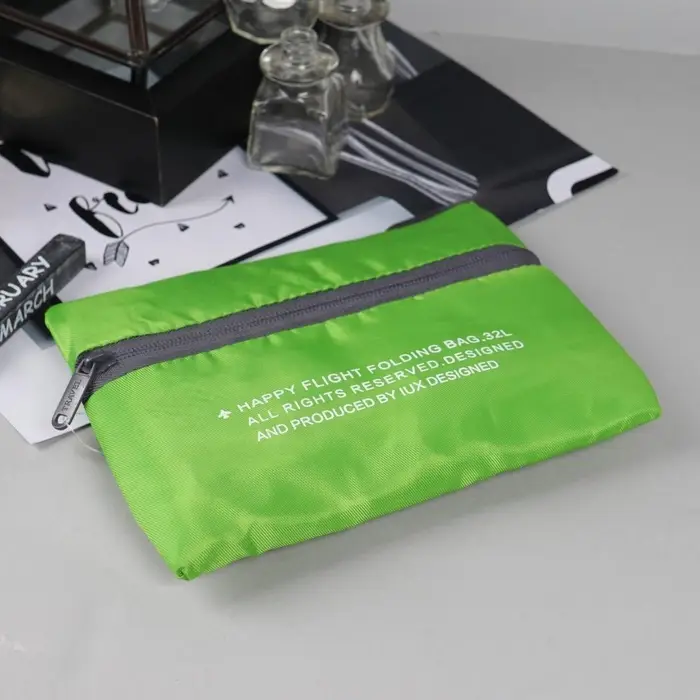 Сумка дорожная на молнии, складная в косметичку, наружный карман, держатель для чемодана, серая, зелёная