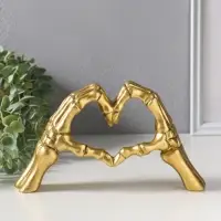 Сувенир полистоун "Руки скелета в форме сердца" золото 24х6,5х13 см