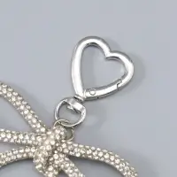 Брелок на карабине "Бант со стразами" серебро 11х7,5х1,5 см