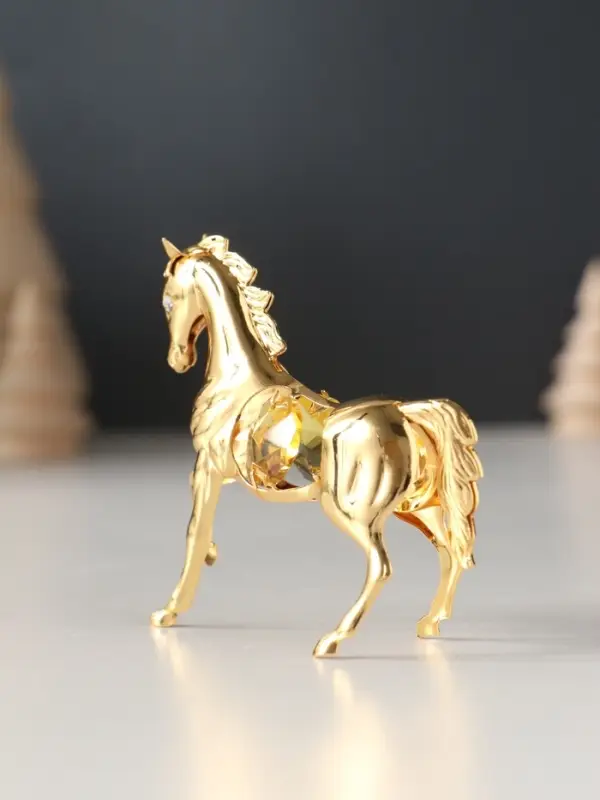 Сувенир Лошадка маленькая с 2-мя желтыми хрусталиками, 7х2х6 см. Сувенир Лошадка маленькая с 2-мя желтыми хрусталиками, 7х2х6 см.