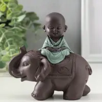 Сувенир полистоун "Маленький будда на слоне" зелёно-коричневый 5,5х12х12 см