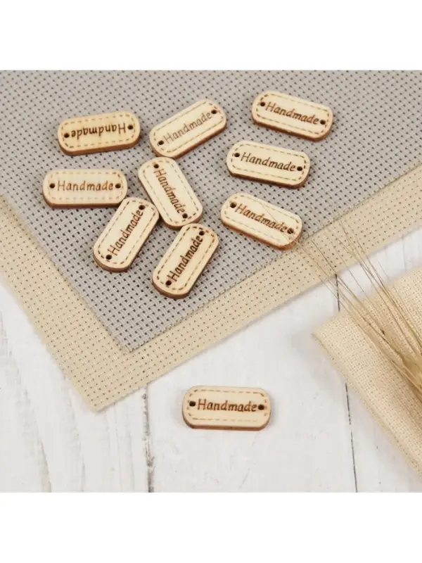 Набор нашивок из дерева Hand made, 2.4×1.2 см, 10 шт. Набор нашивок из дерева Hand made, 2.4×1.2 см, 10 шт.