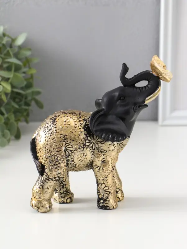 Сувенир полистоун "Чёрный слонёнок с бабочкой на хоботе" с золотом 7,5х12,7х15,7 см