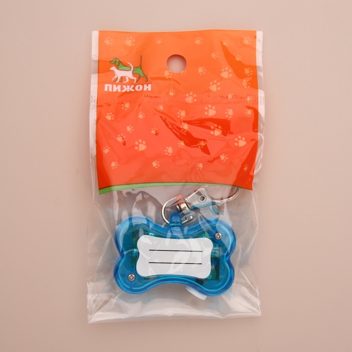 Маячок-адресник Косточка с наклейкой под записку 3 режима свечения голубой Маячок-адресник Косточка с наклейкой под записку 3 режима свечения голубой