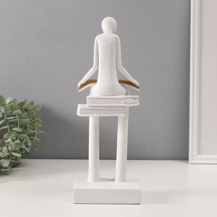 Сувенир полистоун  Сувенир полистоун "Абстракция. Человек сидит на книгах читает" белый с серебром 7,5х11х30 см   10686