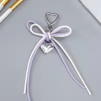 Брелок на карабине "Двойной бант с сердцем" бело-сиреневый 14х9х1,5 см