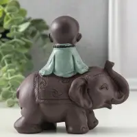 Сувенир полистоун "Маленький будда на слоне" зелёно-коричневый 5,5х12х12 см