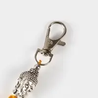 Брелок-кисточка "Будда" 17 см, цв. золотистый, серебристый Брелок-кисточка "Будда" 17 см, цв. золотистый, серебристый