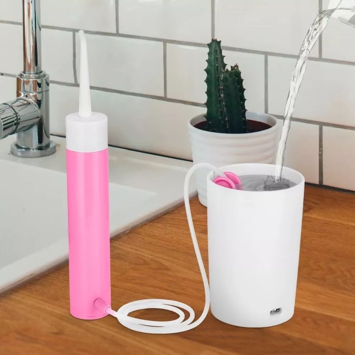 Ирригатор Kitfort КТ-2957-1, портативный, 320 мл, 3 режима, 2 насадки, от АКБ, бело-розовый Ирригатор Kitfort КТ-2957-1, портативный, 320 мл, 3 режима, 2 насадки, от АКБ, бело-розовый