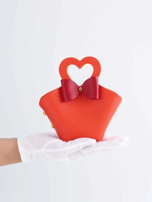 Кожанная подарочная сумочка 10,5 х 5 х 6 см оранжевая Кожанная подарочная сумочка 10,5 х 5 х 6 см оранжевая