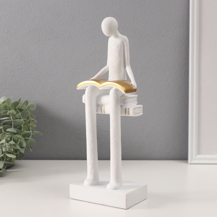 Сувенир полистоун  Сувенир полистоун "Абстракция. Человек сидит на книгах читает" белый с серебром 7,5х11х30 см   10686