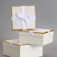 Набор подарочных коробок 3 в 1 квадратные, 19&times;19&times;9.5 см, 17&times;17&times;8 см, 15&times;15&times;6.5 см, с бантом, молочный