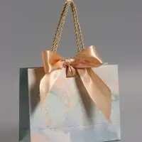 Пакет подарочный "Мрамор" , голубой , с бантиком , 19 х 15 х 7 см