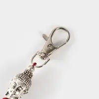 Брелок-кисточка "Будда" 17 см, цв. бордовый, серебристый Брелок-кисточка "Будда" 17 см, цв. бордовый, серебристый