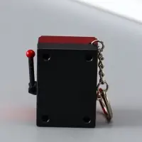 Брелок пластик "Игровой автомат - казино" красный 2,7х3,4х5 см Брелок пластик "Игровой автомат - казино" красный 2,7х3,4х5 см