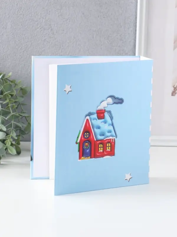 Фотоальбом на 40 фото 13х18 см Фотоальбом на 40 фото 13х18 см "Новогодний домик" в коробке тисн.серебро 5х18х20,8 см