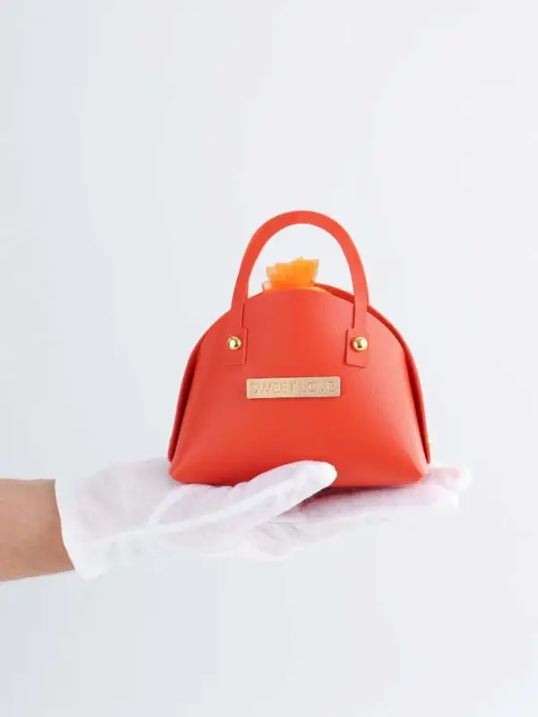 Кожанная подарочная сумочка 14 х 6,5 х 12,8 см оранжевая Кожанная подарочная сумочка 14 х 6,5 х 12,8 см оранжевая