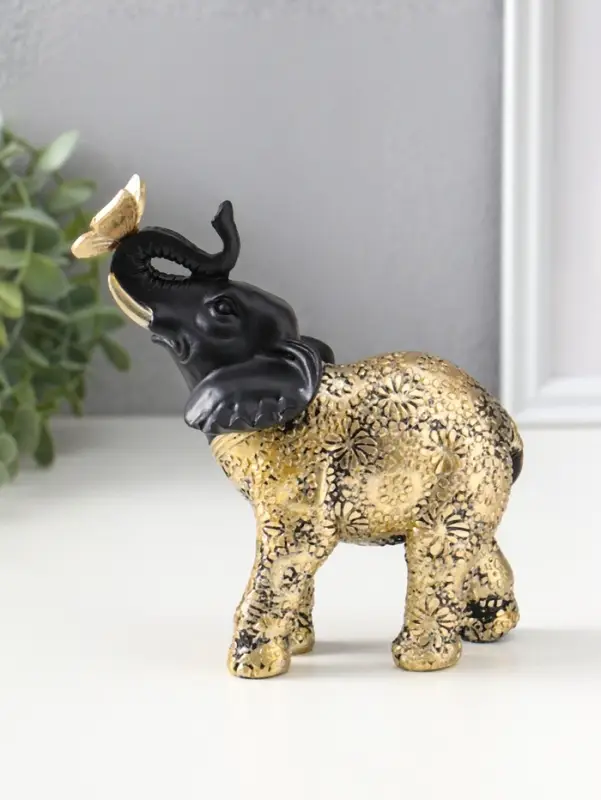 Сувенир полистоун "Чёрный слонёнок с бабочкой на хоботе" с золотом 7,5х12,7х15,7 см