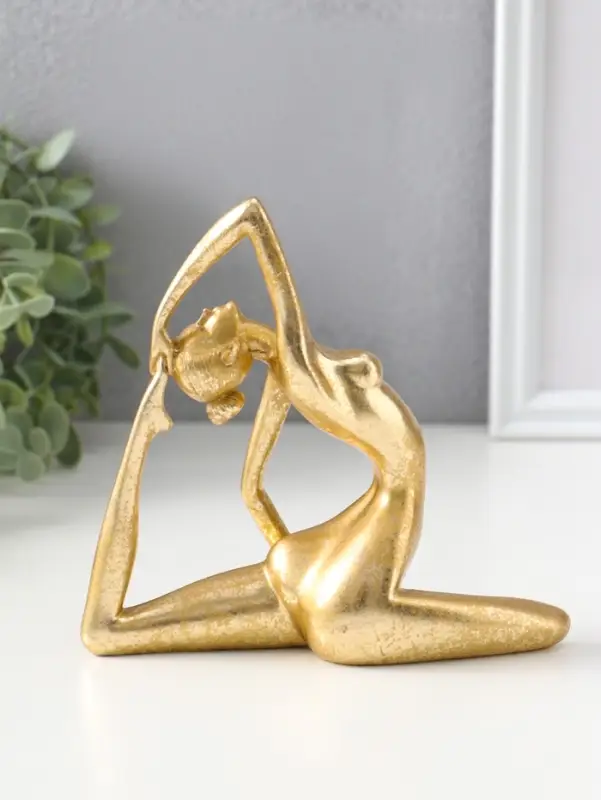 Сувенир полистоун "Обнажённая девушка - йогиня" золото 6,2х16х15,5 см