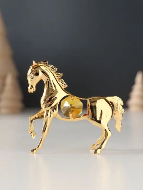 Сувенир Лошадка маленькая с 2-мя желтыми хрусталиками, 7х2х6 см. Сувенир Лошадка маленькая с 2-мя желтыми хрусталиками, 7х2х6 см.