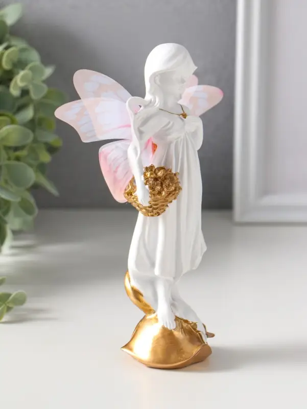 Сувенир полистоун "Девочка-бабочка с золотыми цветами в корзинке" белый 5х6,5х17,2 см