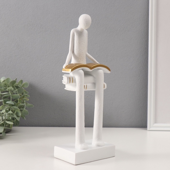 Сувенир полистоун  Сувенир полистоун "Абстракция. Человек сидит на книгах читает" белый с серебром 7,5х11х30 см   10686