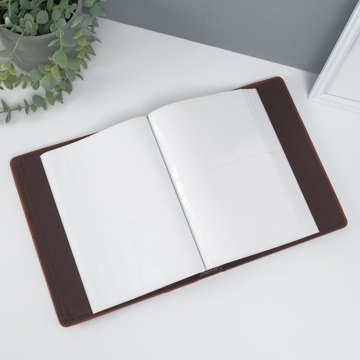 Фотоальбом на 200 фото 10х15 см Фотоальбом на 200 фото 10х15 см "Змея" коричневый кожзам 4х20,3х26,2 см