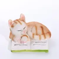 Сувенир полистоун "Спящий котёнок на книге" рыжий 9,5х9х5,7 см