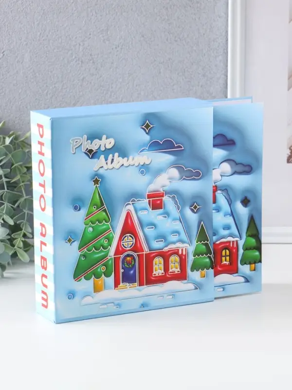 Фотоальбом на 40 фото 13х18 см Фотоальбом на 40 фото 13х18 см "Новогодний домик" в коробке тисн.серебро 5х18х20,8 см