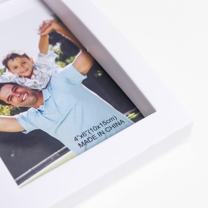 Фоторамка пластик на 6 фото 10х15 см  Фоторамка пластик на 6 фото 10х15 см "Выгнутая" белая 29,5х46 см