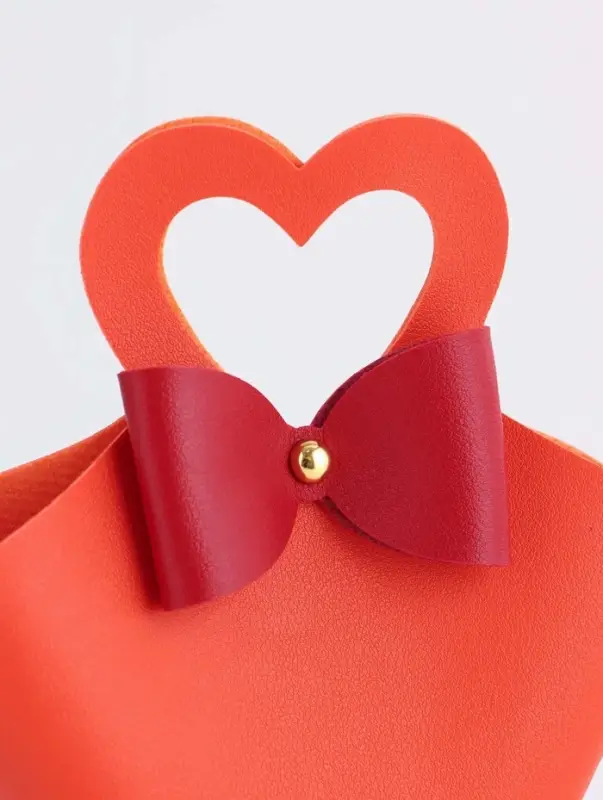 Кожаная подарочная сумочка для бижутерии и сувениров, оранжевая с бантом, 10.5&times;5&times;6 см