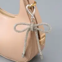 Брелок на карабине "Бант со стразами" серебро 11х7,5х1,5 см