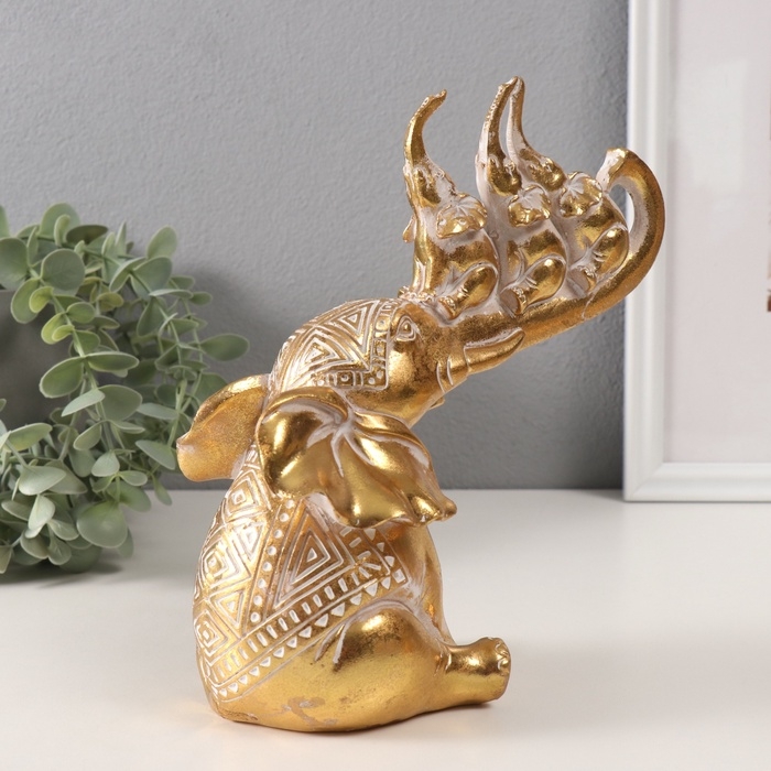 Сувенир полистоун Сувенир полистоун "Слон и 3 слонёнка на хоботе. Индейские узоры" золото 19,8х10,3х21,5 см