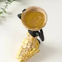 Подсвечник полистоун "Африканка в косынке с цветами" золото d=8 см 14х15х27,5 см Подсвечник полистоун "Африканка в косынке с цветами" золото d=8 см 14х15х27,5 см