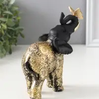 Сувенир полистоун "Чёрный слонёнок с бабочкой на хоботе" с золотом 7,5х12,7х15,7 см