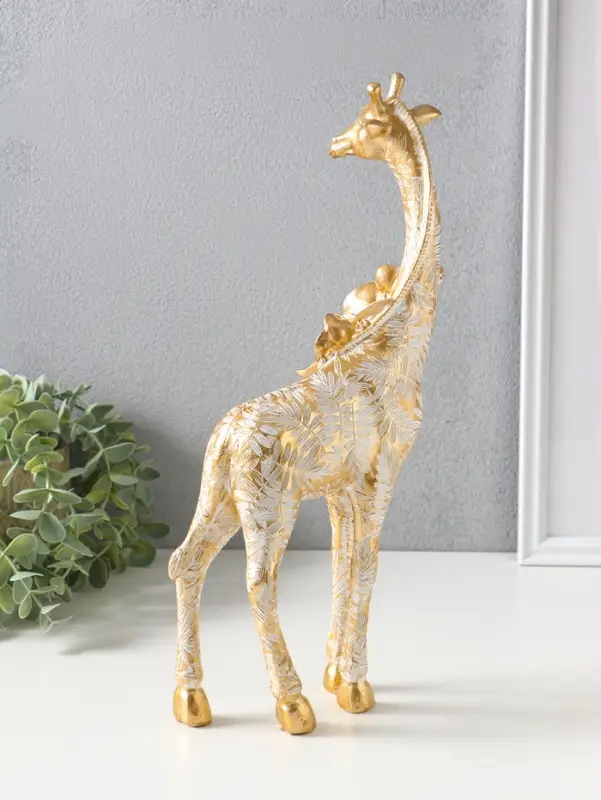 Сувенир полистоун "Жираф с листьями и цветами" бело-золотой 17,3х8,3х35,5 см