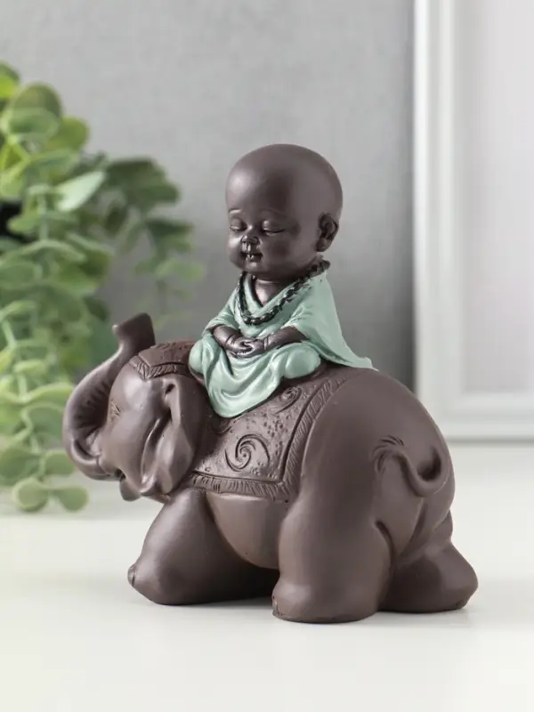 Сувенир полистоун "Маленький будда на слоне" зелёно-коричневый 5,5х12х12 см