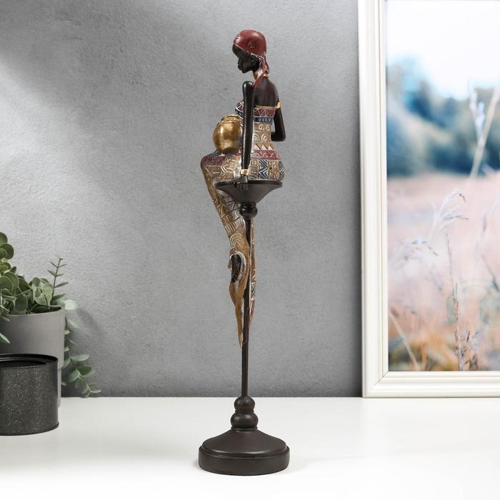 Сувенир полистоун  Сувенир полистоун "Африканка с кувшином, в наряде - геометрия, на стуле" 43х11х9,3 см