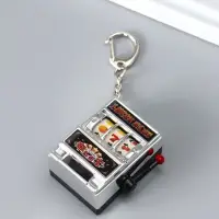 Брелок пластик "Игровой автомат - казино" серебро 2,7х3,4х5 см Брелок пластик "Игровой автомат - казино" серебро 2,7х3,4х5 см