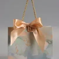 Пакет подарочный "Мрамор" , голубой , с бантиком , 19 х 15 х 7 см