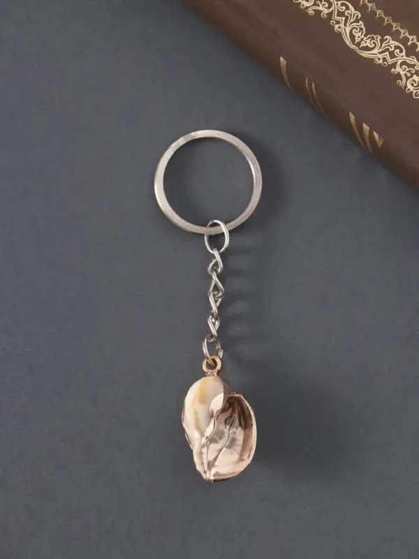 Брелок пластик "Ракушка в клетку" с золотом 3х2х1,2 см